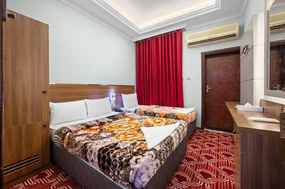 Family room with two beds at Homa Hotel in Naif, Dubai